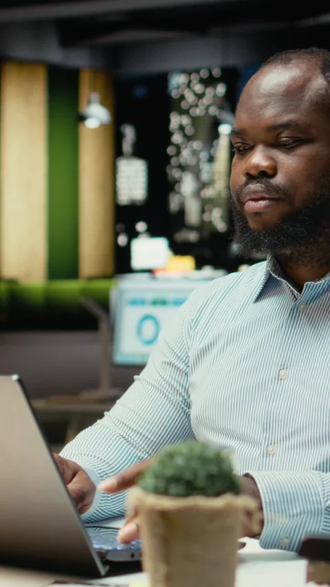 Vertical Video Black person proofreading and fact checking financial numbers Video stock 319593640
