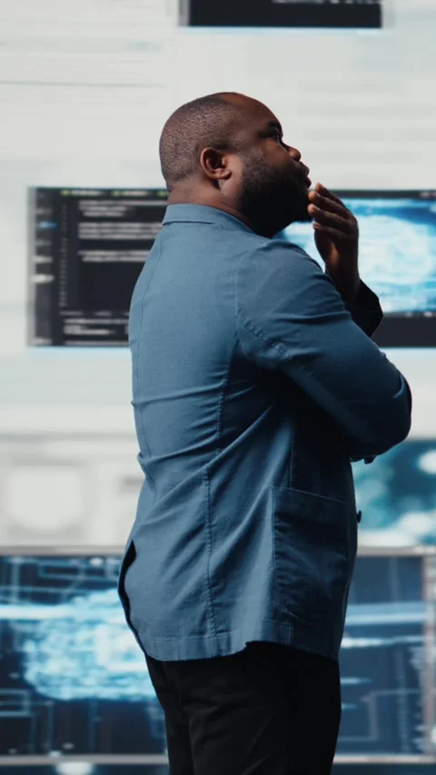 Vertical Video Black programmer expert engaging in software development at high Stock Footage 312178881