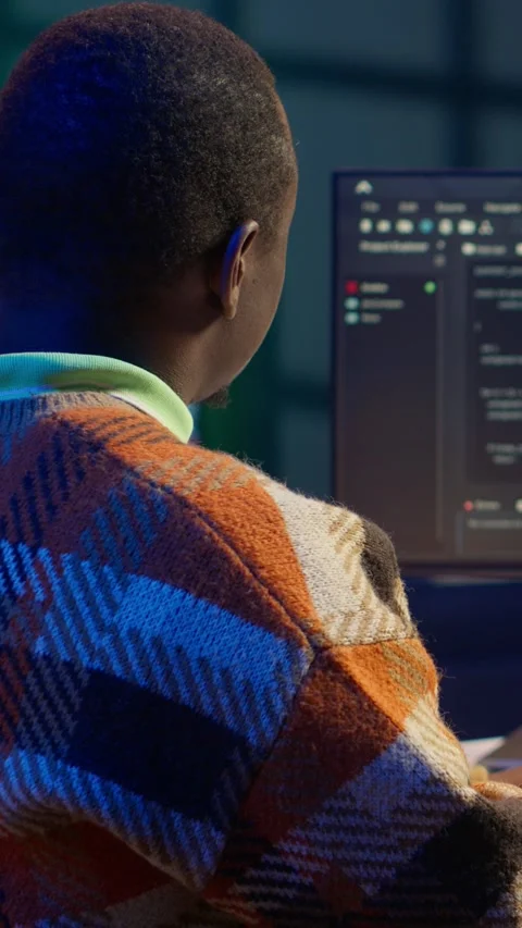 Vertical Video Black software engineer writes complex binary code scripts on Stock Footage 319550758