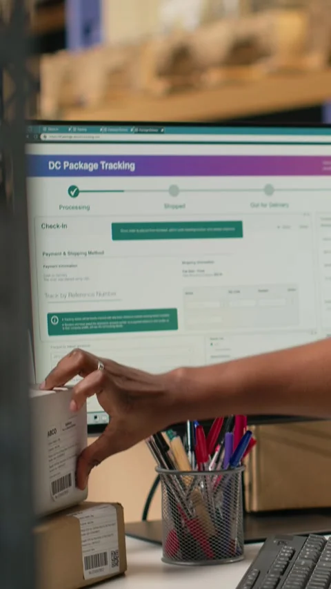 Vertical Video Black worker applying and scanning barcodes awb tags on cargo Stock Footage 315192149