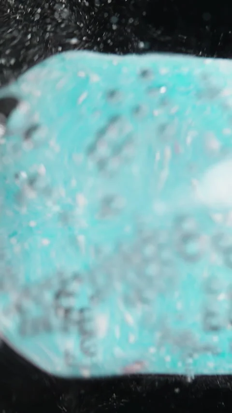 Vertical video. Blue Bath Bomb Dissolving Underwater, Surrounded by Bubbles and Stock Footage 283305958