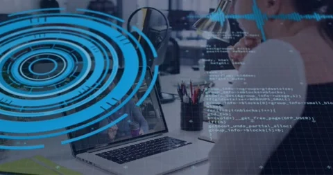 Vertical video: Blue HUD appearing man wearing vest studying laptop at office Stock Footage 330741524