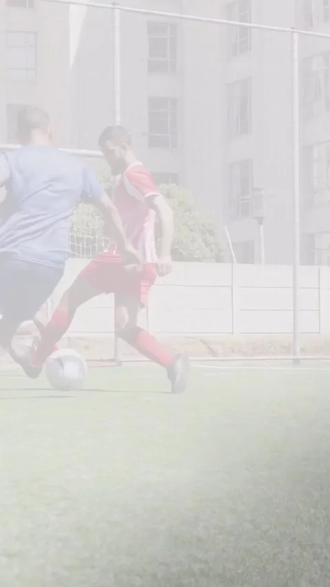 Vertical video: Blue player receiving ball dribbling to soccer goal reds closing Stock Footage 340133554