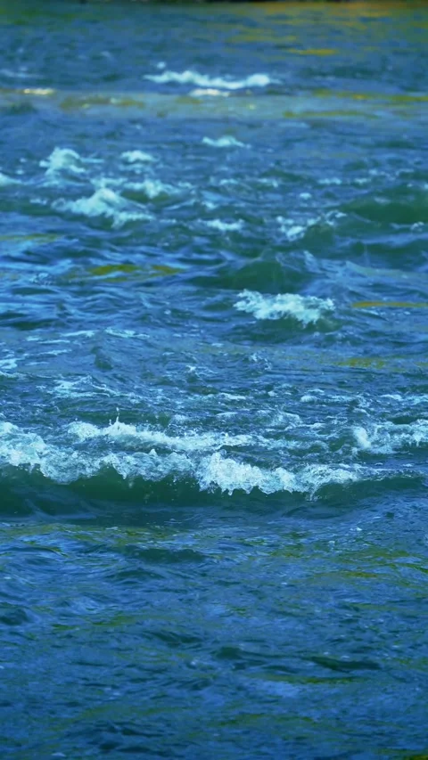 Vertical video of blue river current Stock Footage 336318359