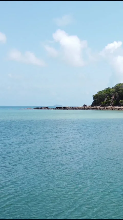 Vertical Video of blue tranquil sea with waves and skyline Stock Footage 276582458