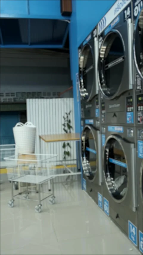 Vertical video, blurry public laundry Stock Footage 272165337