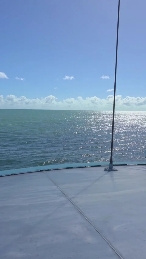 Vertical video of Boat navigating on a sunny ocean day in the great barrier reef Stock Footage 330879007