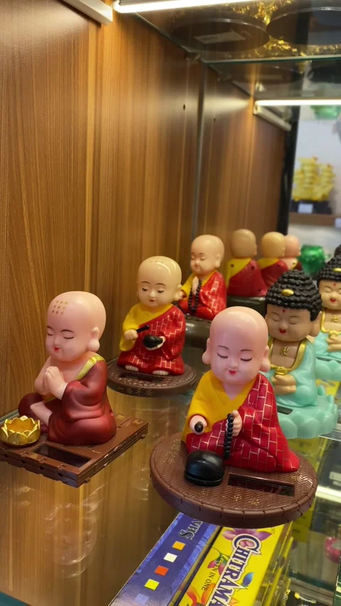 Vertical video of bobblehead Buddhist monk dolls Stock Footage 311911487