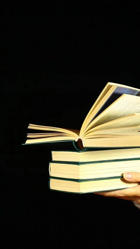 Vertical video of book hand dark background Stock Footage 239731128