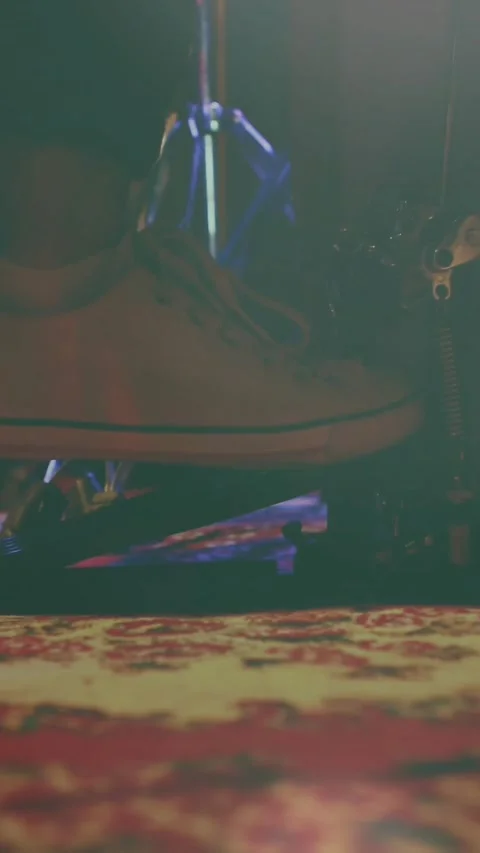 Vertical video: Boot hanging on pole sensing vibration, swinging and settling on Stock Footage 332317578