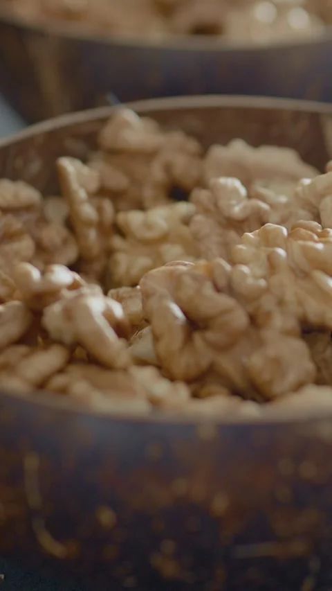 Vertical video Bowl of walnut kernels rich in healthy fats for your snack Stock Footage 329617559