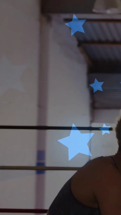 Vertical video: Boxer guarding and striking mitt moving, training, blue star Stock Footage 334544020