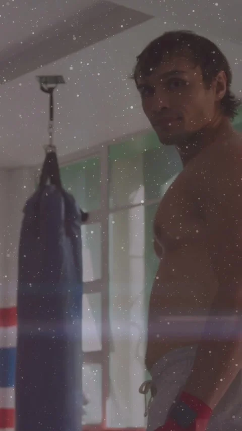 Vertical video: Boxer shifting, turning head by bag, red wraps, lensflare Stock Footage 331721302