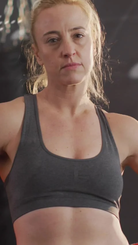 Vertical video: Boxer standing gym, projector on code overlay moving across Stock Footage 330509992