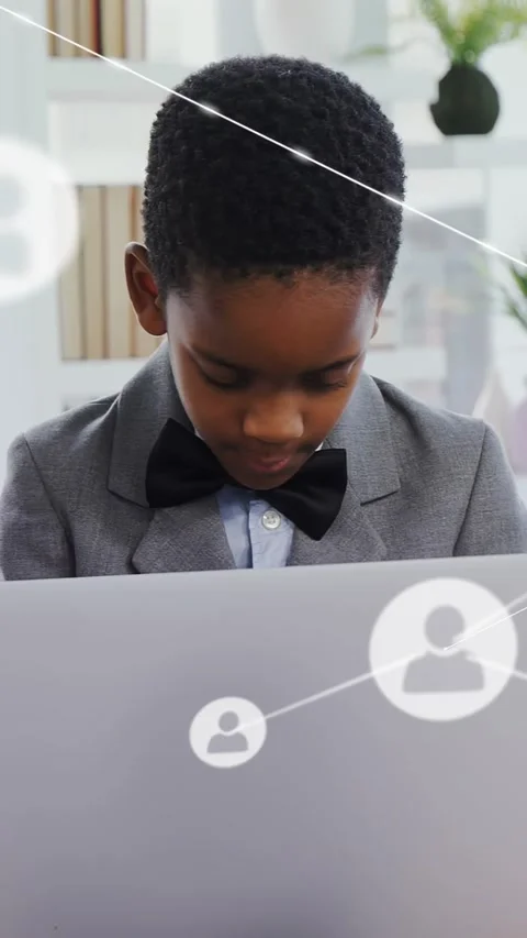 Vertical video: Boy at desk using laptop, pause starting edu icons and lines Stock Footage 334317596