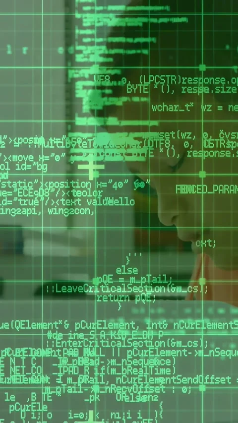 Vertical video: Boy leaning toward PC, green code overlay appearing on face and Stock Footage 334396924