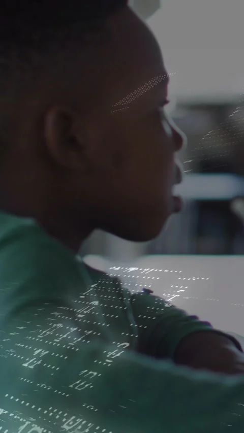 Vertical video: Boy leaning at white table causing light dots drifting across Stock Footage 331404994