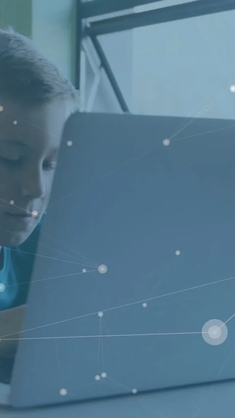 Vertical video: Boy leaning by window, tapping laptop and starting nodes, codes Stock Footage 331237943