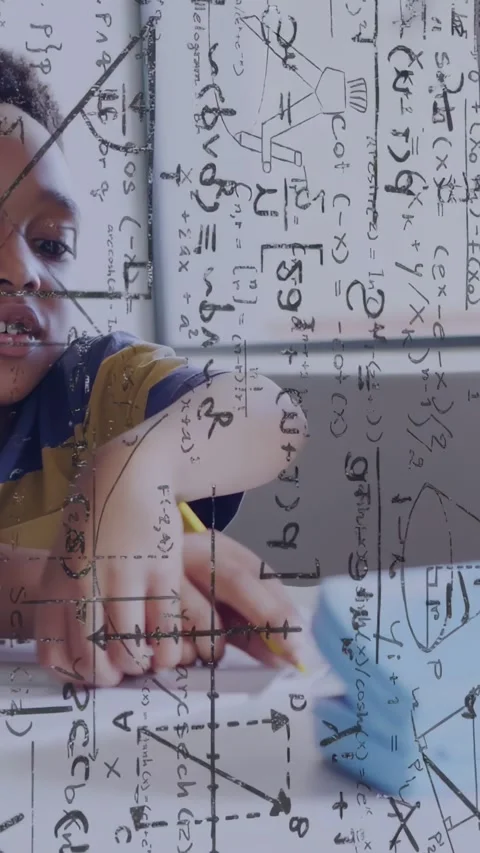 Vertical video: Boy reaching toward blue robot, nudging it across paper while Stock Footage 334378664