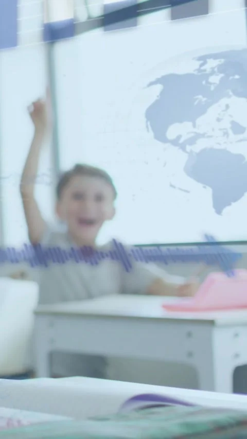 Vertical video: Boy smiling, raising right hand after teacher prompt, school map Stock Footage 331270872