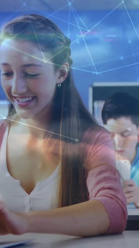 Vertical video: Boy tapping white tablet, cloud data moving to girl typing Stock Footage 331270928