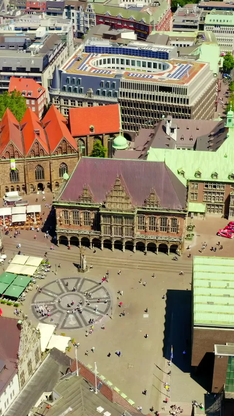 Vertical video. Bremen, Germany. St. Petri Dom twin spires and Bremen Town Hall Stock Footage 334285805