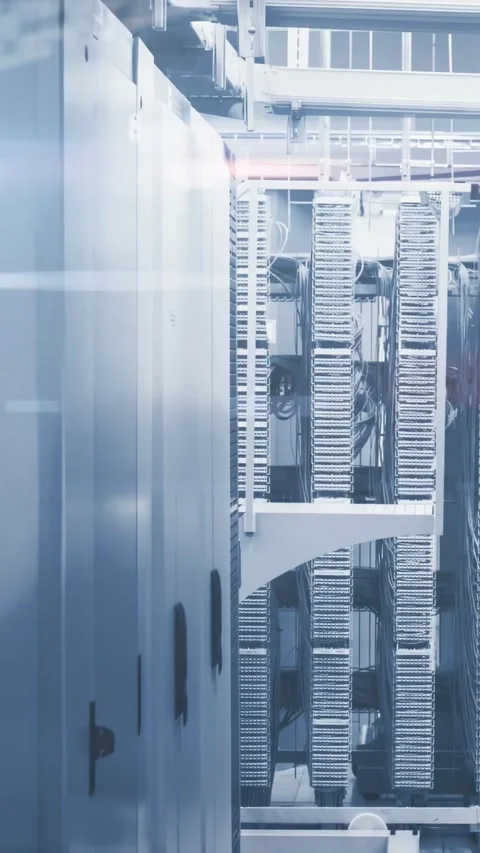 Vertical video: Brief pause starting white code scrolling over server racks, Stock Footage 331237881