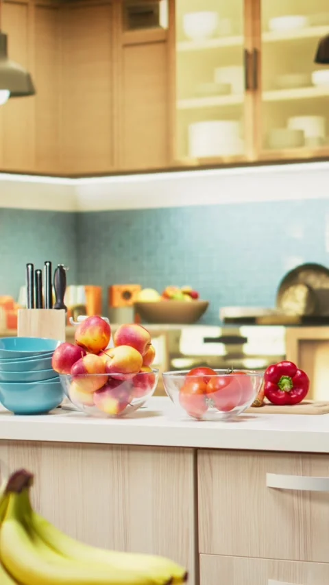 Vertical Video Bright modern kitchen interior with elegant furniture and wooden Stock Footage 321256883
