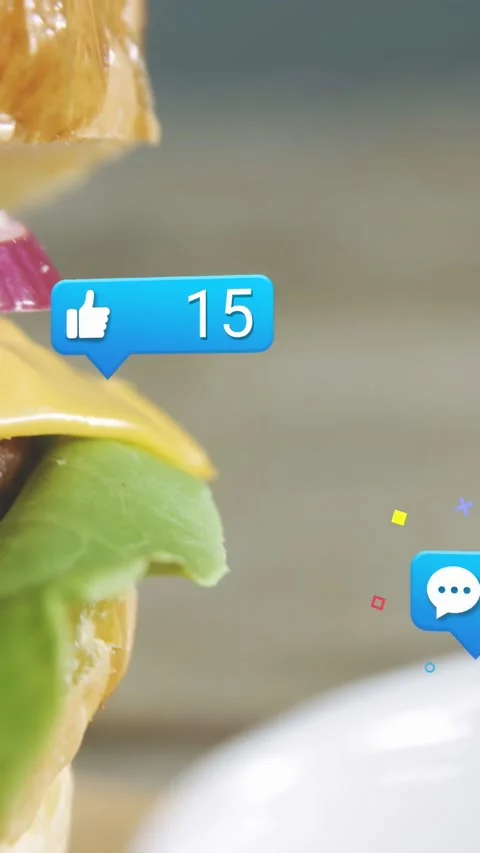 Vertical video: Bubbles popping, stacked burger sliding in, confetti marking Stock Footage 332845565