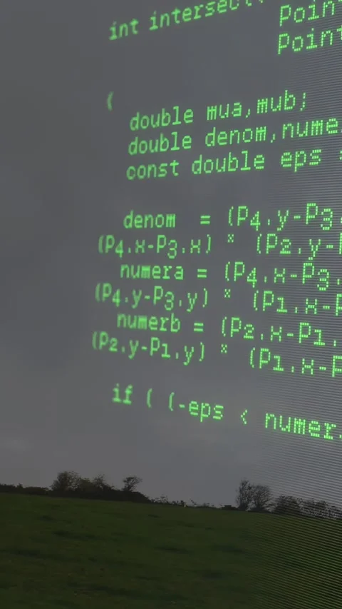 Vertical video: Buffer loop running, green code scrolling over field revealing Stock Footage 330395241