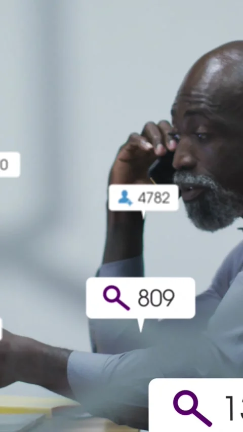 Vertical video: Business exec calling and gesturing, incoming data updating Stock Footage 330509558