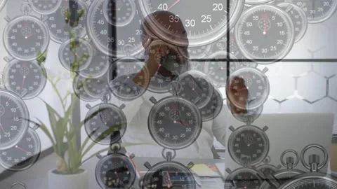 Vertical video: Business man taking call checking laptop while timer overlay Stock Footage 331176194