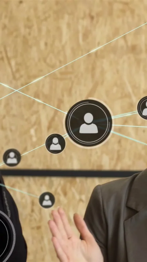 Vertical video: Business team tapping floating UI expanding network nodes Stock Footage 334602605