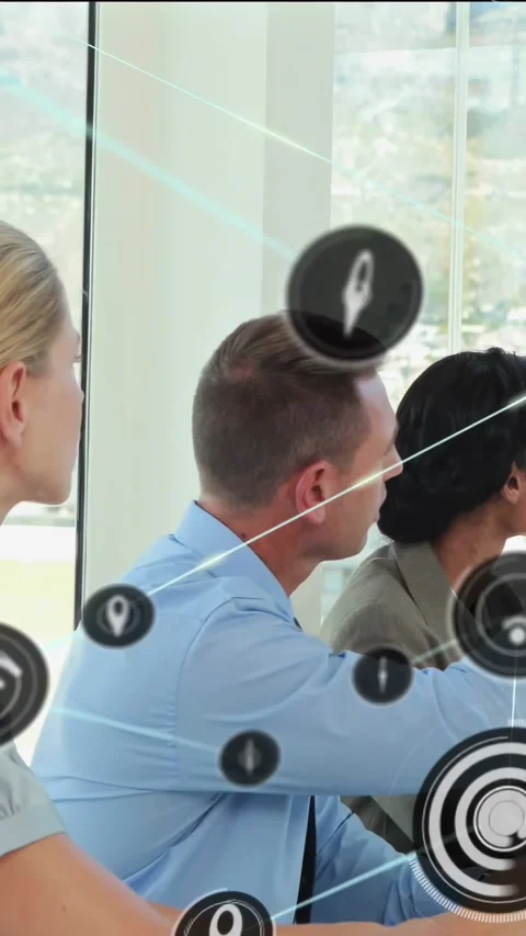 Vertical video: Business team watching off-frame presenter, AR icons appearing Stock Footage 334317668