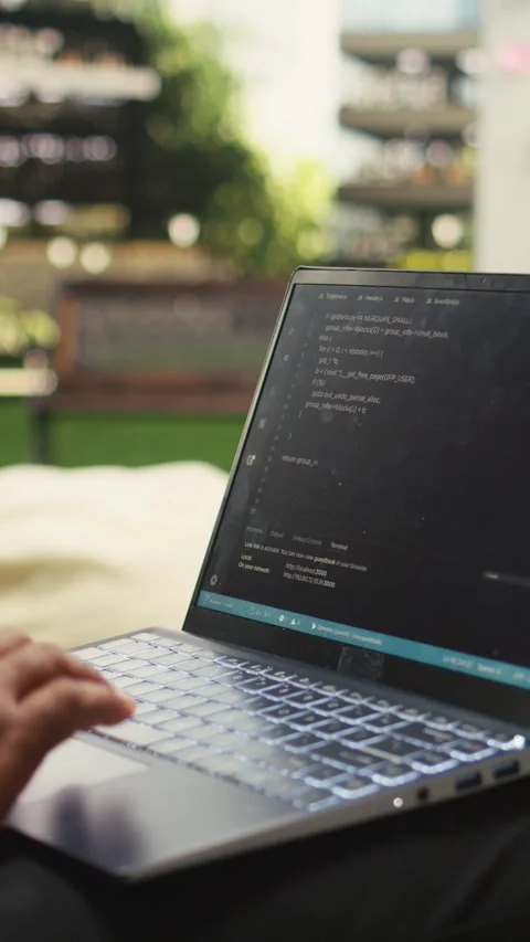 Vertical Video Businessman programmer using binary code on laptop during Stock Footage 339070848