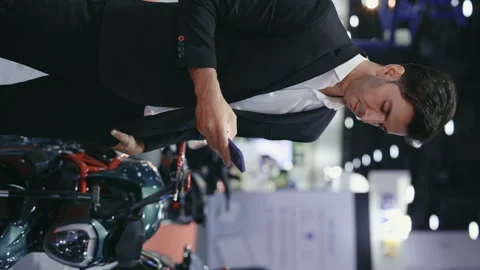 Vertical Video. Businessman Solves Cases on Cell Phone While Standing Against Video stock 264622036