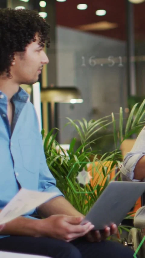 Vertical video: Businessman tapping tablet and projecting animated chart onto Stock Footage 331338172