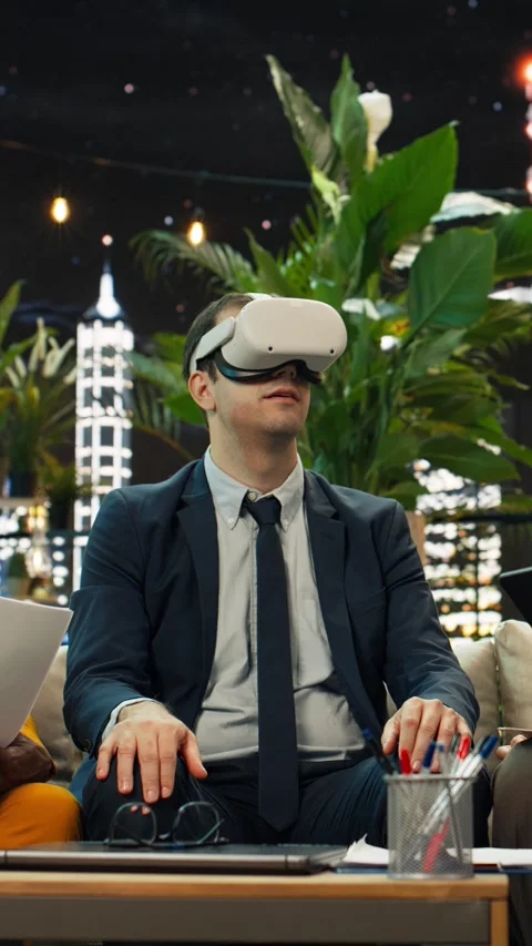 Vertical video Businessman testing VR headset at rooftop team demonstration Stock Footage 347814241