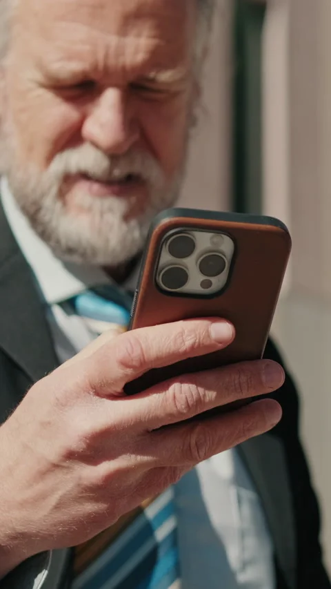 Vertical video, Businessman Using Smartphone in the City Stock Footage 316989738