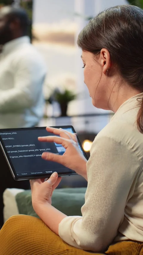Vertical video Businesswoman analyzes code using AI model on tablet in rooftop Stock Footage 345166807