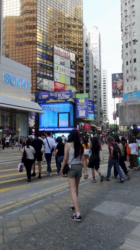 Vertical video of a busy crowd of Chinese crossing the traffic Stock Footage 313672000