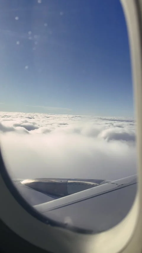 Vertical video from the cabin of a passenger plane, view from the window onto Video stock 327858794