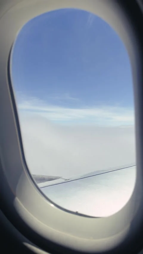 Vertical video from the cabin of a passenger plane, view from the window onto Video stock 332762576
