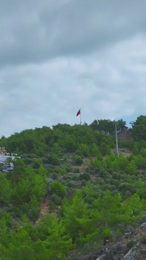 Vertical Video: Cable Lift Taking People to the Top of the Mountain with Stock-Footage 297736976