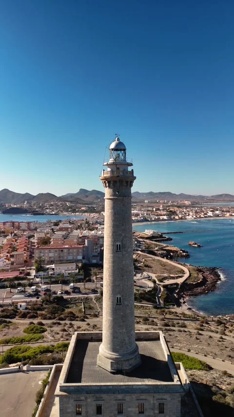 Vertical video of the Cabo de Palos lighthouse in Murcia, Spain. Costa Cali.. Stock Footage 259845270