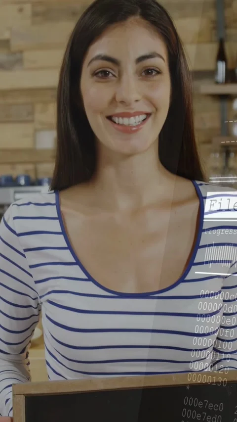 Vertical video: Cafe owner holding Open sign, pullback revealing face, file bar Stock Footage 333513523