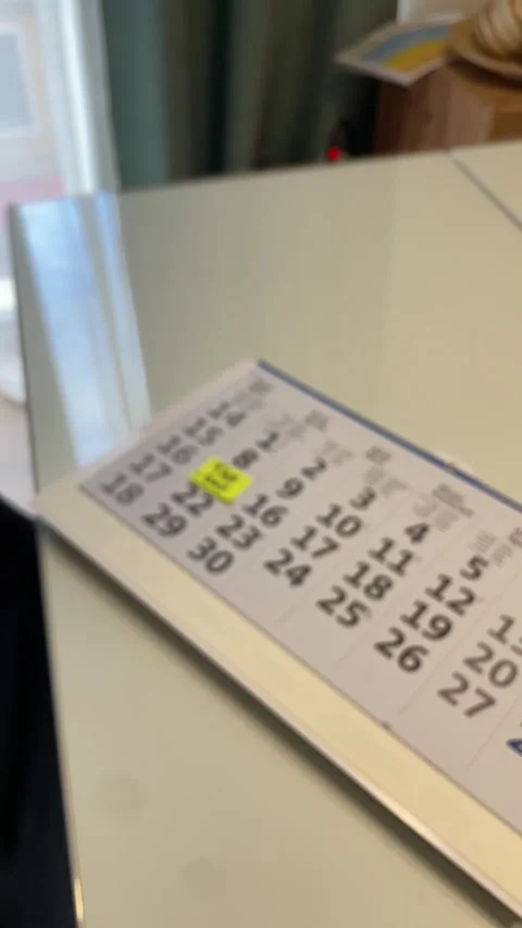 Vertical video. Calendar pointing at April 15th 2024, Tax Day in the USA for Stock Footage 265051750