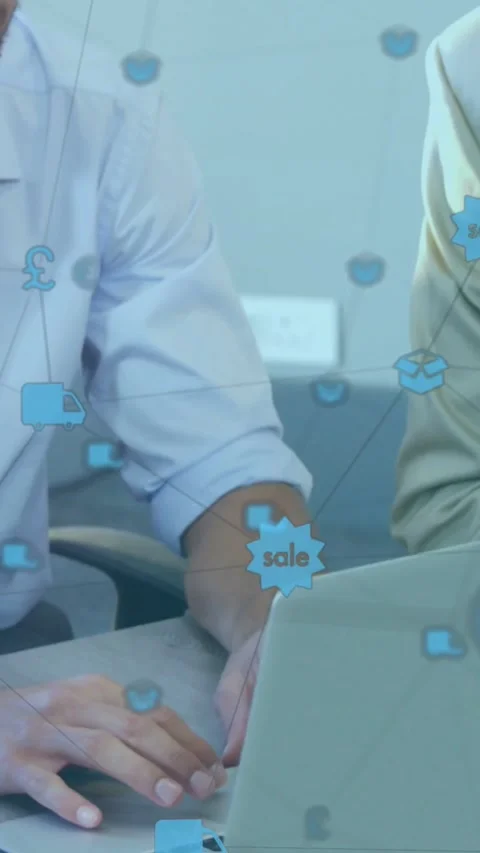 Vertical video: Cam panning left showing laptop user typing checking sales icons Stock Footage 334387388