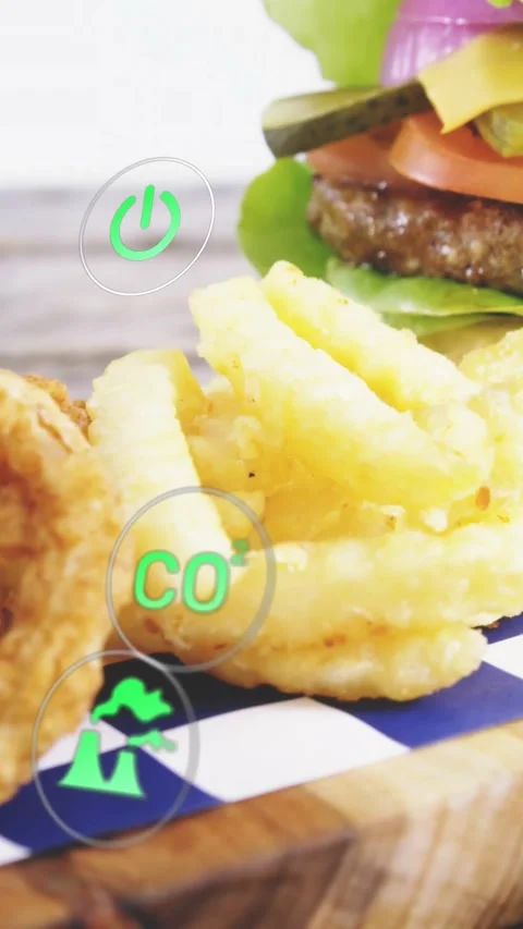 Vertical video: Cam panning right, fries centered while green icons sliding to Stock Footage 328398690