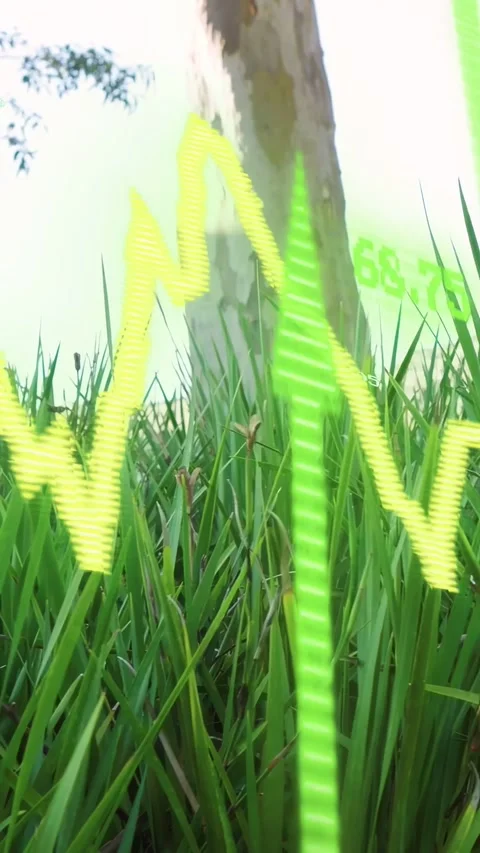 Vertical video: Cam tilting, grass revealing, tree rising, neon wave shifting, Stock Footage 335513947